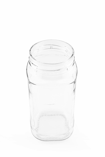 empty glass jar with screw cap close up on white background side view