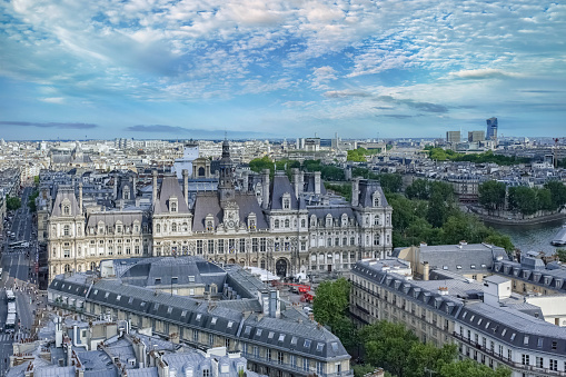 aerial shot of Trocadero, Jardins du Trocadero, Palais de Chaillot in Paris. The business district of La Defense, sits in the background just outside of Paris proper.