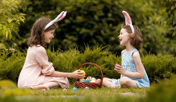 istock children with painting eggs outdoors 1986687006