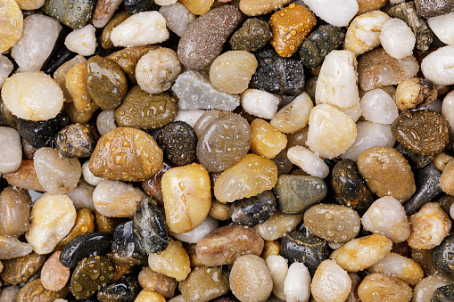 Close up of smooth and colorful pebbles with copy space
