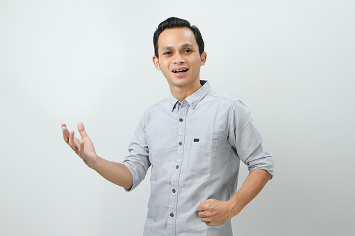 cheerful happy confident asian indonesian man on isolated background