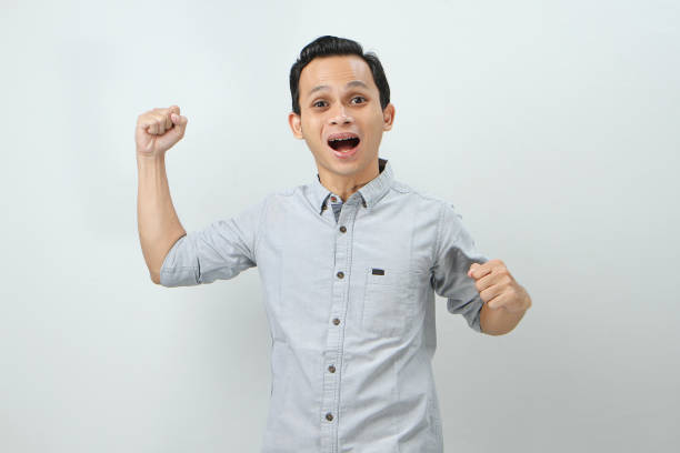 istock happy confident asian indonesian man on isolated background 1986759434