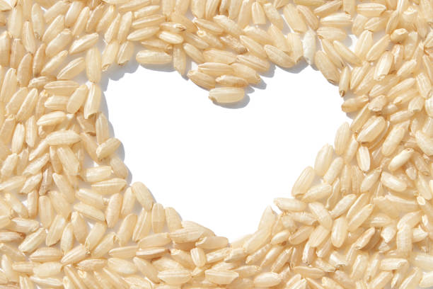A heart-shaped rice pile, symbolizing love, unity, and hope. The grains, diverse and wholesome, reflect global solidarity. Care, health, and nutrition, fostering a sense of harmony and charity.