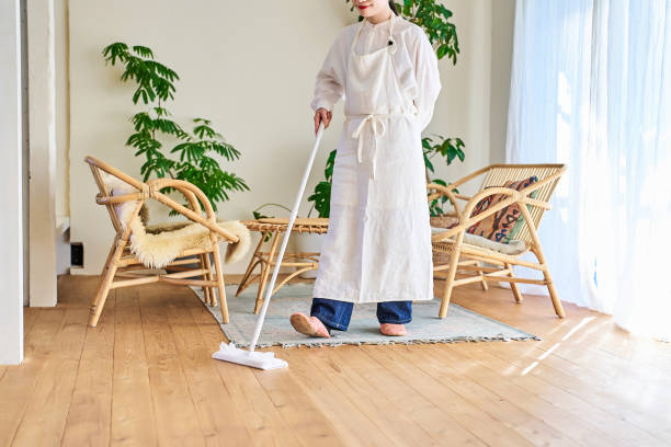 istock Young woman cleaning the flooring 1986800807