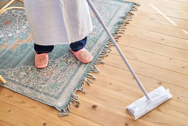 istock Young woman cleaning the flooring 1986801441