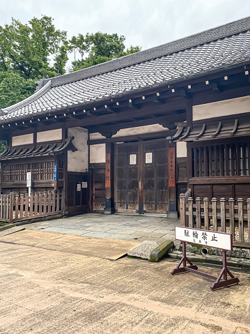 Tokyo, Japan - June 8, 2023: A magnificent and beautiful Japanese shrine or temple in summer during cloudy day. Concept for tourism, tourist attraction, vacation, destination, Shinto and buddhist.
