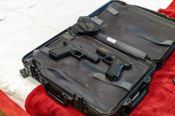 istock two pistols in open bag 1986861804