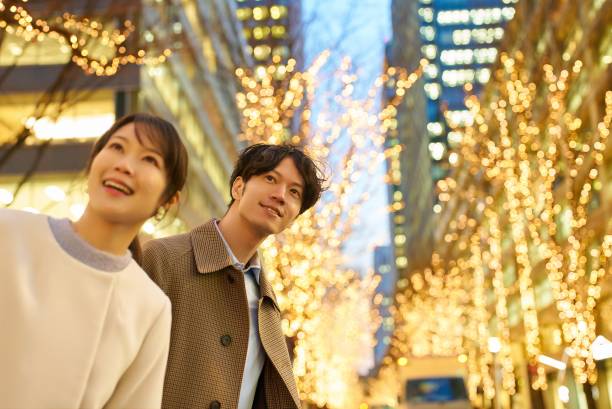 istock Man and woman enjoying the illuminated night view 1986865484