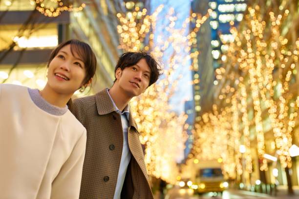 istock Man and woman enjoying the illuminated night view 1986865998