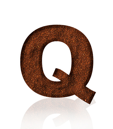 Close-up of three-dimensional grind coffee bean alphabet letter Q on white background.