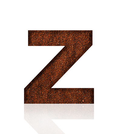 Close-up of three-dimensional grind coffee bean alphabet letter Z on white background.