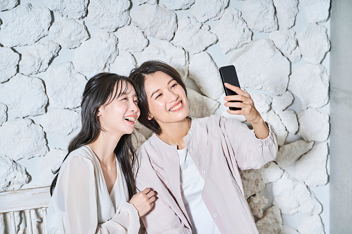 Two women looking at smartphone screen