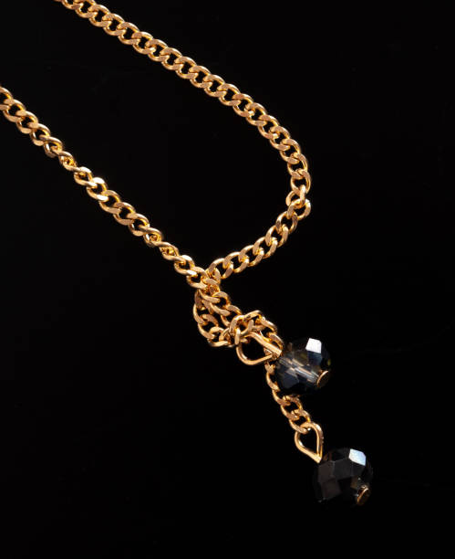 istock Gold chain isolated on black background. Close-up 1986900294