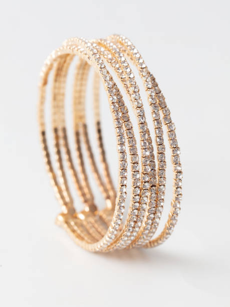istock Gold bracelet isolated white background 1986928587