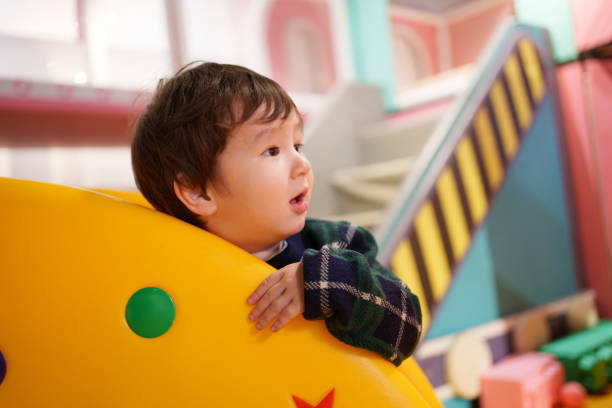 istock Children playing in children's playground 1986972837
