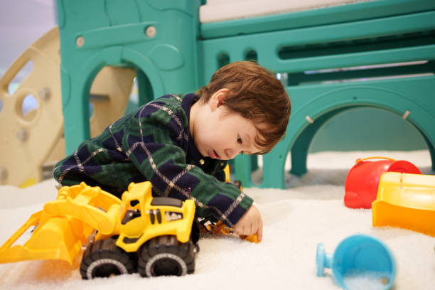 istock children playing with toys 1986974421