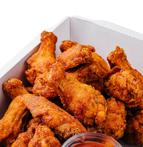 istock Takeaway box of crispy grilled chicken legs 1986975553