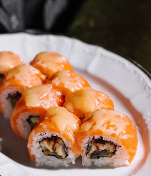 Photo of Salmon Fried sushi roll with eel and cheese