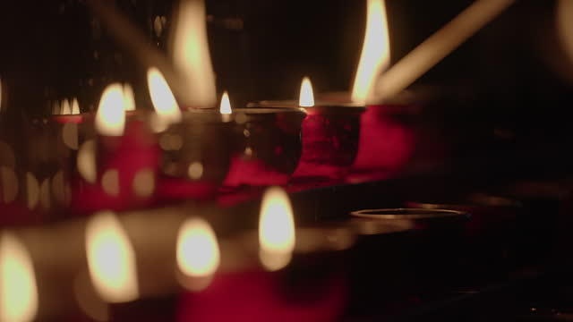 Mystical Burning Candles Flickering in Dark Night Lights