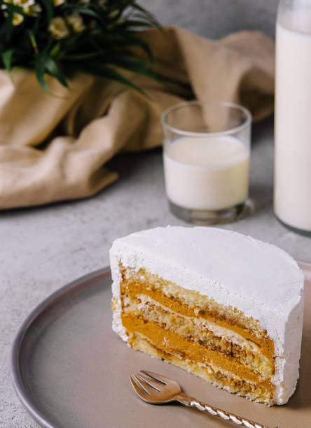 istock Delicious cake with whipped cream and caramel filling 1987016423