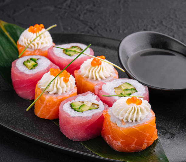istock sushi rolls wrapped with salmon and tuna 1987027331