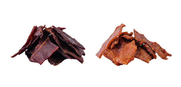 istock Dried beef and pork jerkies isolated on white background 1987028395