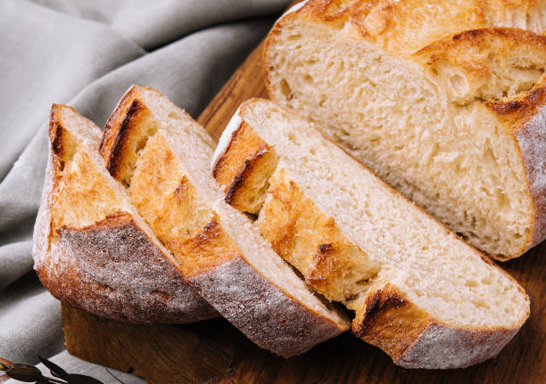 istock Sliced bread on the board close up 1987036300