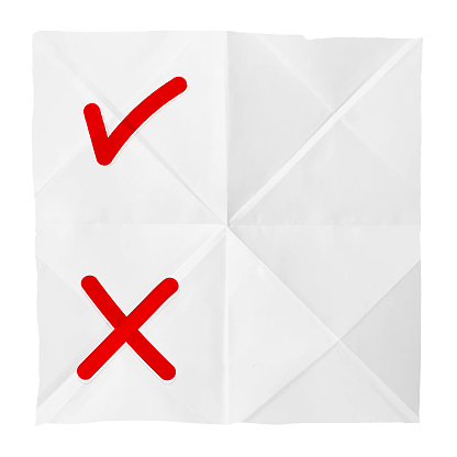 White coloured crushed wrinkled paper horizontal vector backgrounds with folds and creases all over like a plain page with cut torn uneven edges and one big check or tick and one cross or X mark for uncertainty, choice, decision between right and wrong