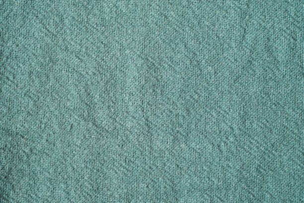 istock Green cotton fabric texture background, Wrinkle surface textile, wallpaper, banner 1987065905