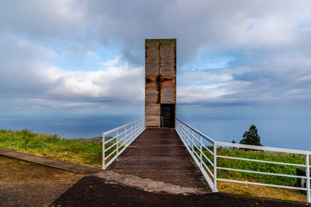 Elevated view on the Church of São Pedro (Igreja Paroquial de São Pedro) and waterfront of Ponta Delgada with Sao Miguel´s volcanic landscape in the distance. Sao Miguel, Azores, Portugal