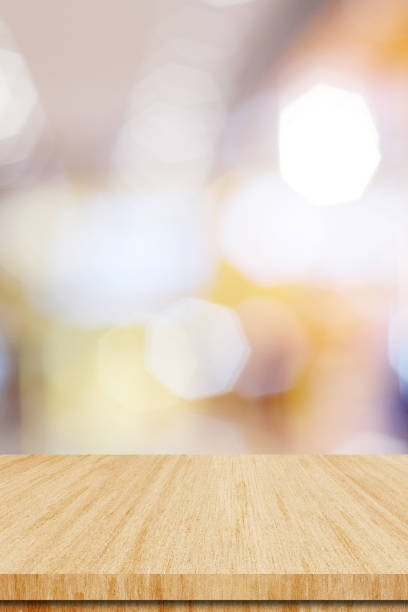 Vertical wood table background and blur background, Empty wooden counter, shelf surface over blur restaurant with bokeh background, Wood table top for retail shop, store product display backdrop, banner, mock up, template