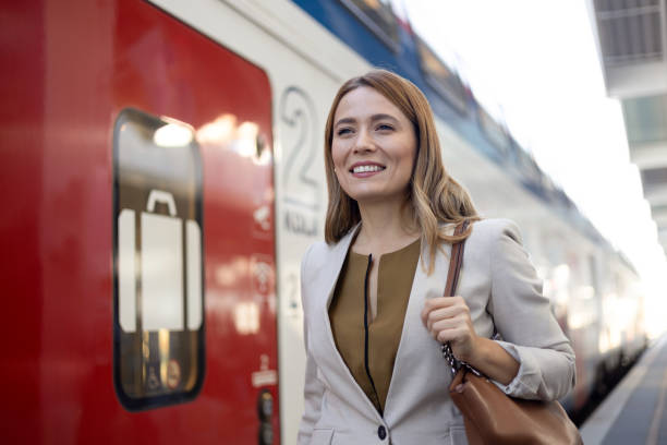 istock Young woman commuting to work by rail 1987087401