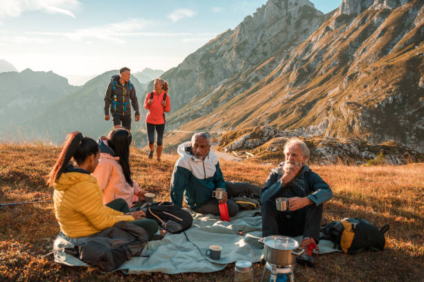 istock Diverse Hiking Group Drinking Tea at the Summit 1987087570