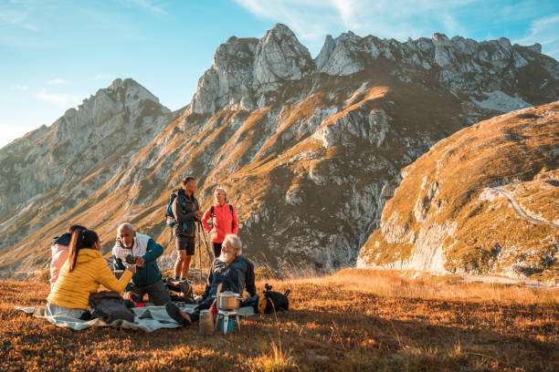 istock Hilltop Tea Pause with Diverse Hiking Friends 1987087934
