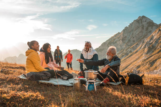 istock Hilltop Tea Pause with Diverse Hiking Friends 1987087956