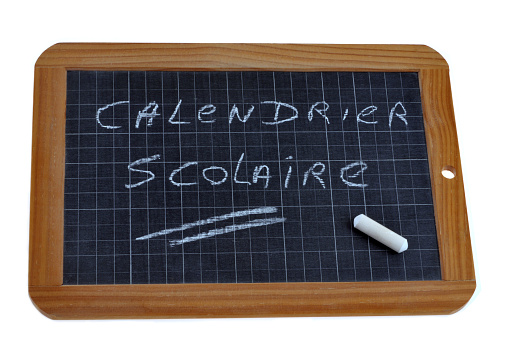 School calendar written in french on a school slate with chalk