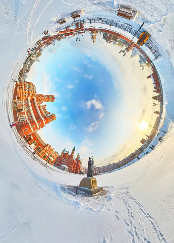 Cityscape of downtown district, an Orthodox red brick churches and palaces on a city embankment at a winter sunny day, round 360-degree view, Yoshkar-Ola, Volga region, Russia.