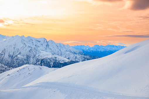 Panoramic landscape Alps mountain peak. Winter sport, ski resort.  Enjoying on sunset  sunny  ski resorts. Powder snow Snowcapped mountain  Dolomite super ski area. Ski resort. Sellaronda, italy, Europe