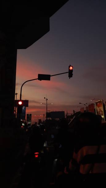 istock nice orange sunset on the street 1987167803