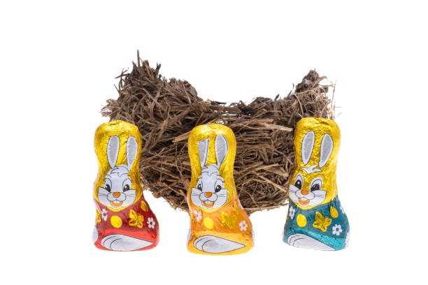 Easter rabbit between two buckets full of eggs