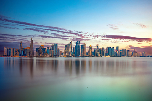 Doha, Qatar - October 14, 2023: The Panoramic skyline of Doha, Qatar during sunrise
