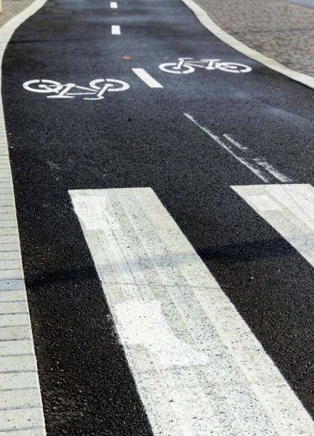 istock Asphalt road with bicycles inscription along markings 1987185317