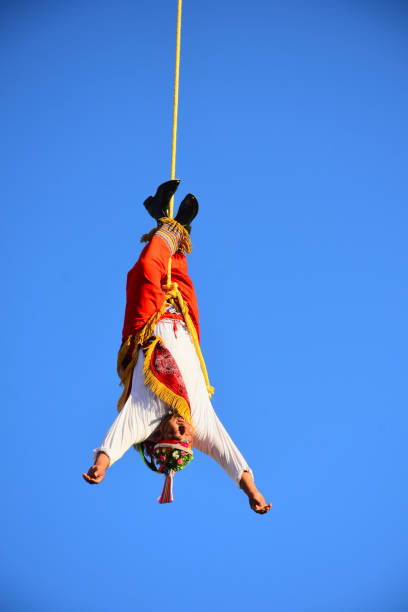 Leon, Mexico. Feb 3. Voladores de Papantla -Papantla Flyers- performing an antique 600 B.C. Totonaca ritual to Gods to get long life, wellness and prosperity, from El Tajin, Papantla, Veracruz, Mexico during Feria de Leon at Heritage Plaza on February 3, 2024 in Leon, Mexico.