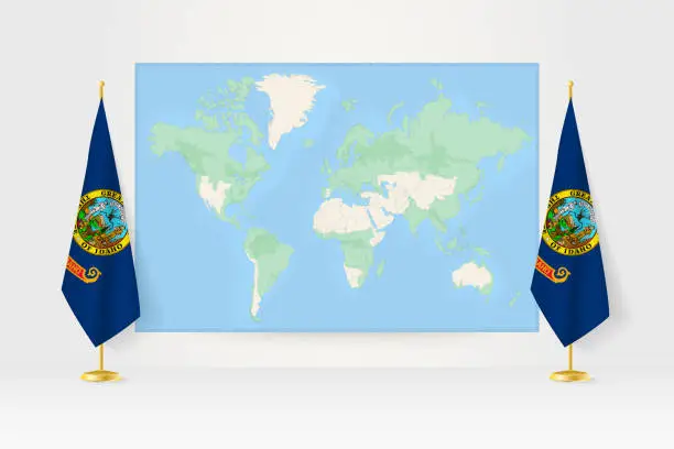 Vector illustration of World Map between two hanging flags of Idaho flag stand.