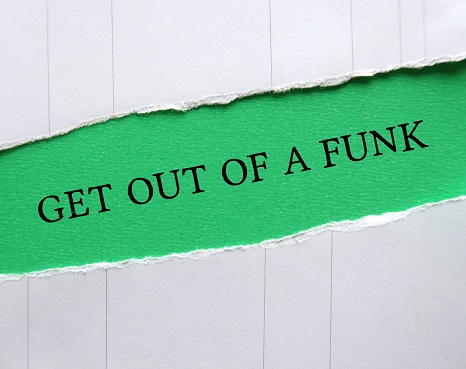Green torn paper with text GET OUT OF A FUNK, to remind self to get back from feeling depressed, out of control, or overly emotional, take an off-day and turn it into a productive one