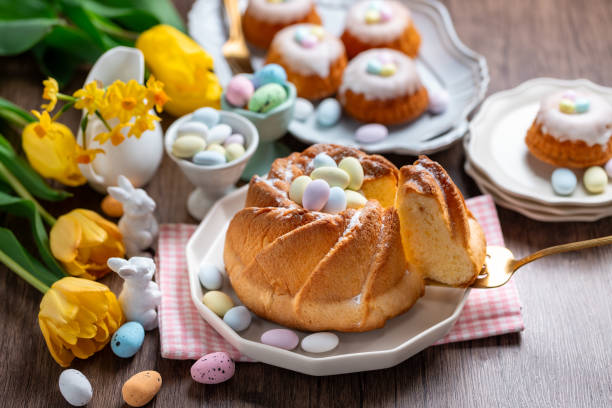 istock Easter yeast cake sprinkled with powdered sugar, decorated with chocolate eggs. Traditional Easter cake 1987196512