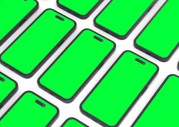 istock Realistic smartphones mockup with green chromakey screen flat lay on white background 1987206239