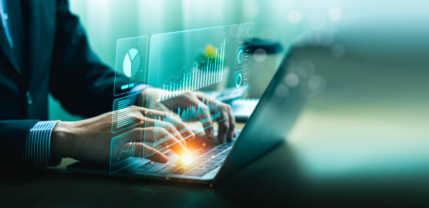 istock Businessman using laptop and analyzing economic growth, financial graph and business investment. planning strategy, stock market statistics, stock market trends, technical analysis strategy, value 1987214879