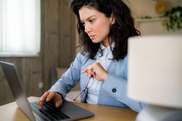 istock Serious businesswoman working in office 1987218948