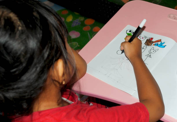 Kids ready to illustrate some creative ideas at a workshop